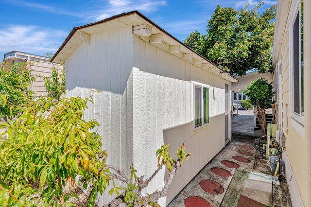 a backyard of a house with outdoor seating