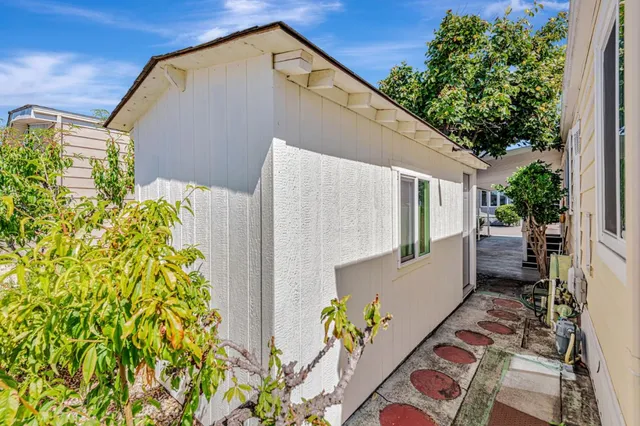 a backyard of a house with outdoor seating