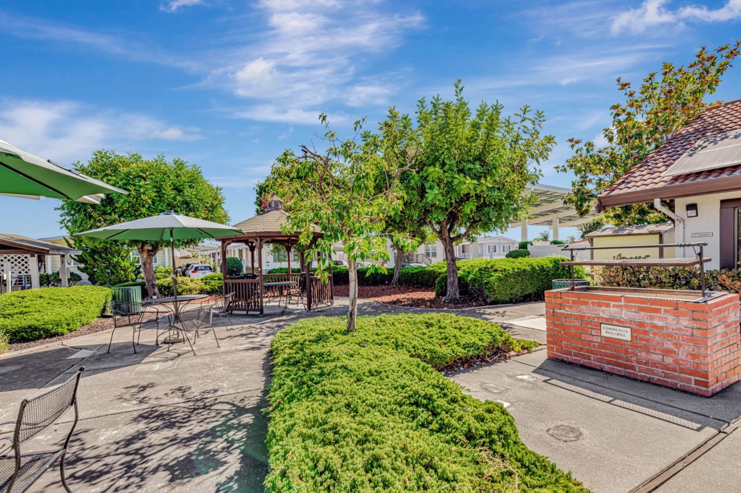 29129 Verdi Road, Unit 29129 Hayward, CA 94544 - Photo 31 of 37 a view of a patio with table and chairs under an umbrella