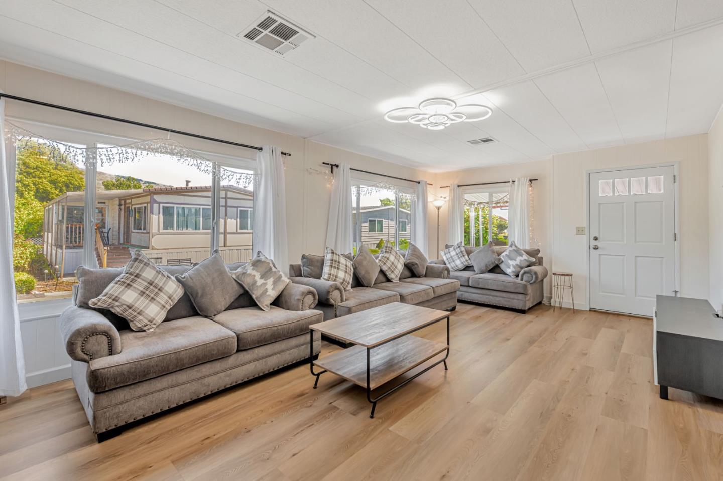 29129 Verdi Road, Unit 29129 Hayward, CA 94544 - Photo 7 of 37 a living room with furniture and a large window