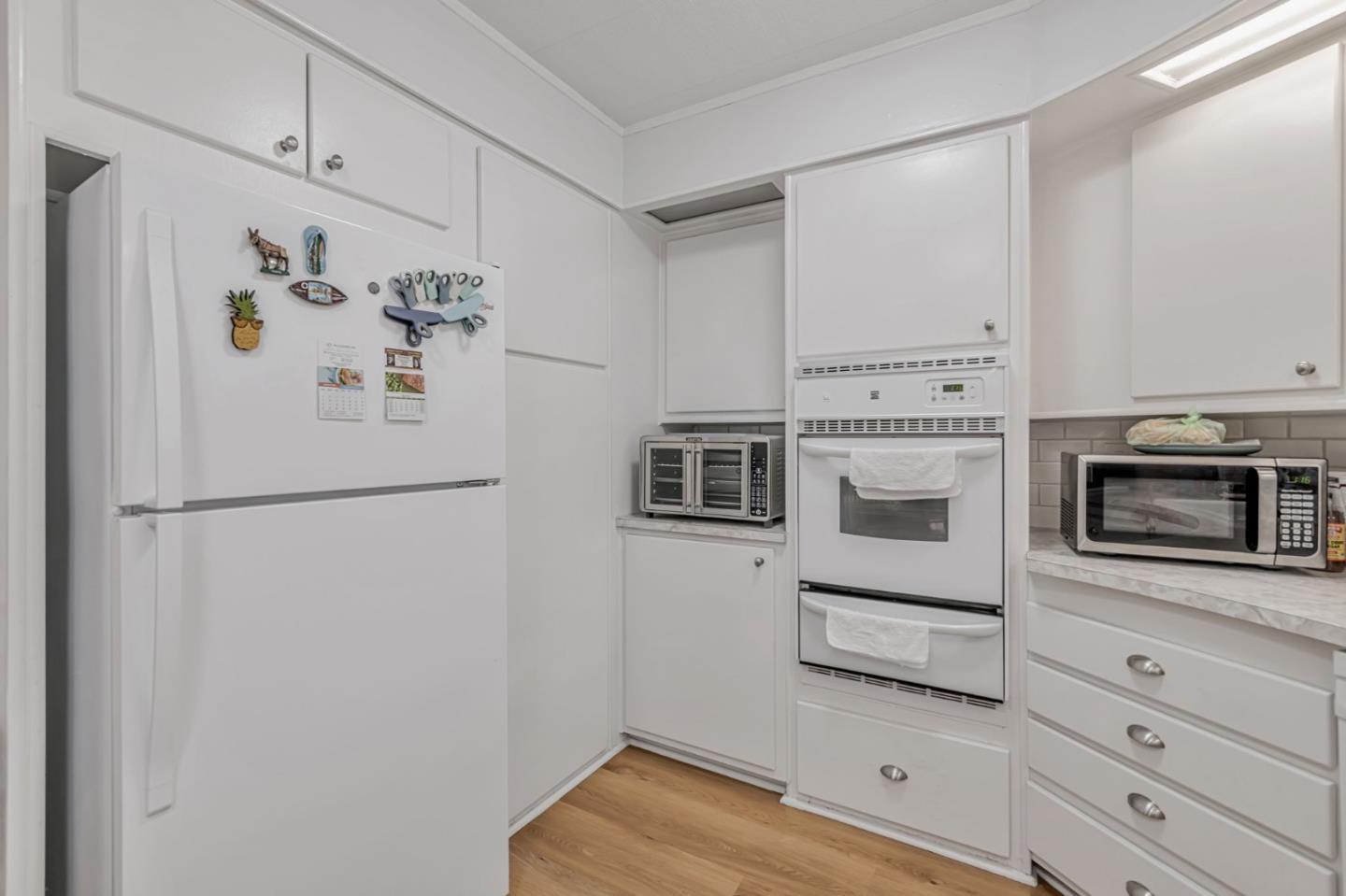 29129 Verdi Road, Unit 29129 Hayward, CA 94544 - Photo 9 of 37 a white refrigerator freezer sitting in a kitchen