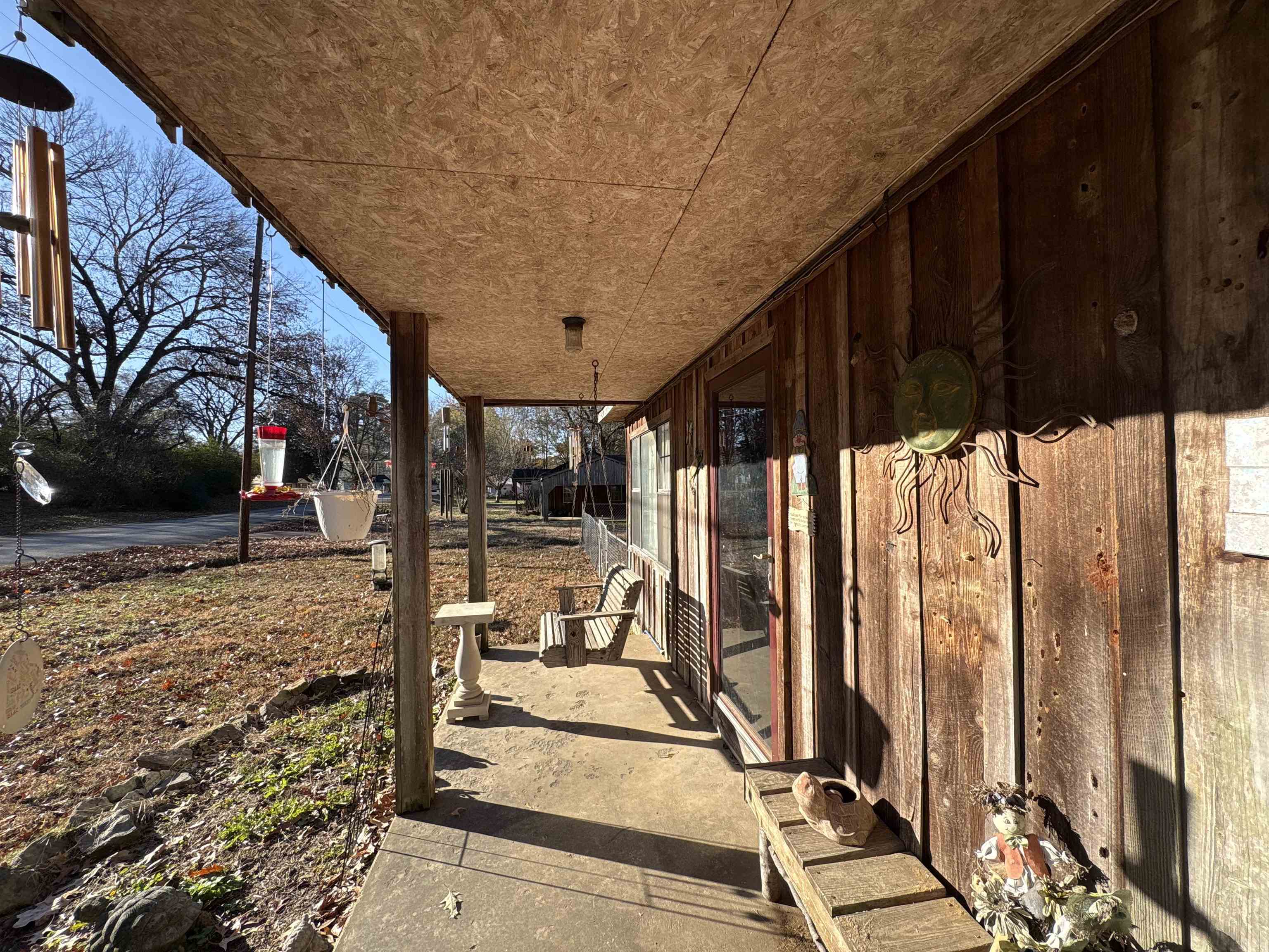 5091 Clinton Road Memphis, TN 38109 - Photo 24 of 34 a view of a backyard with a large tree