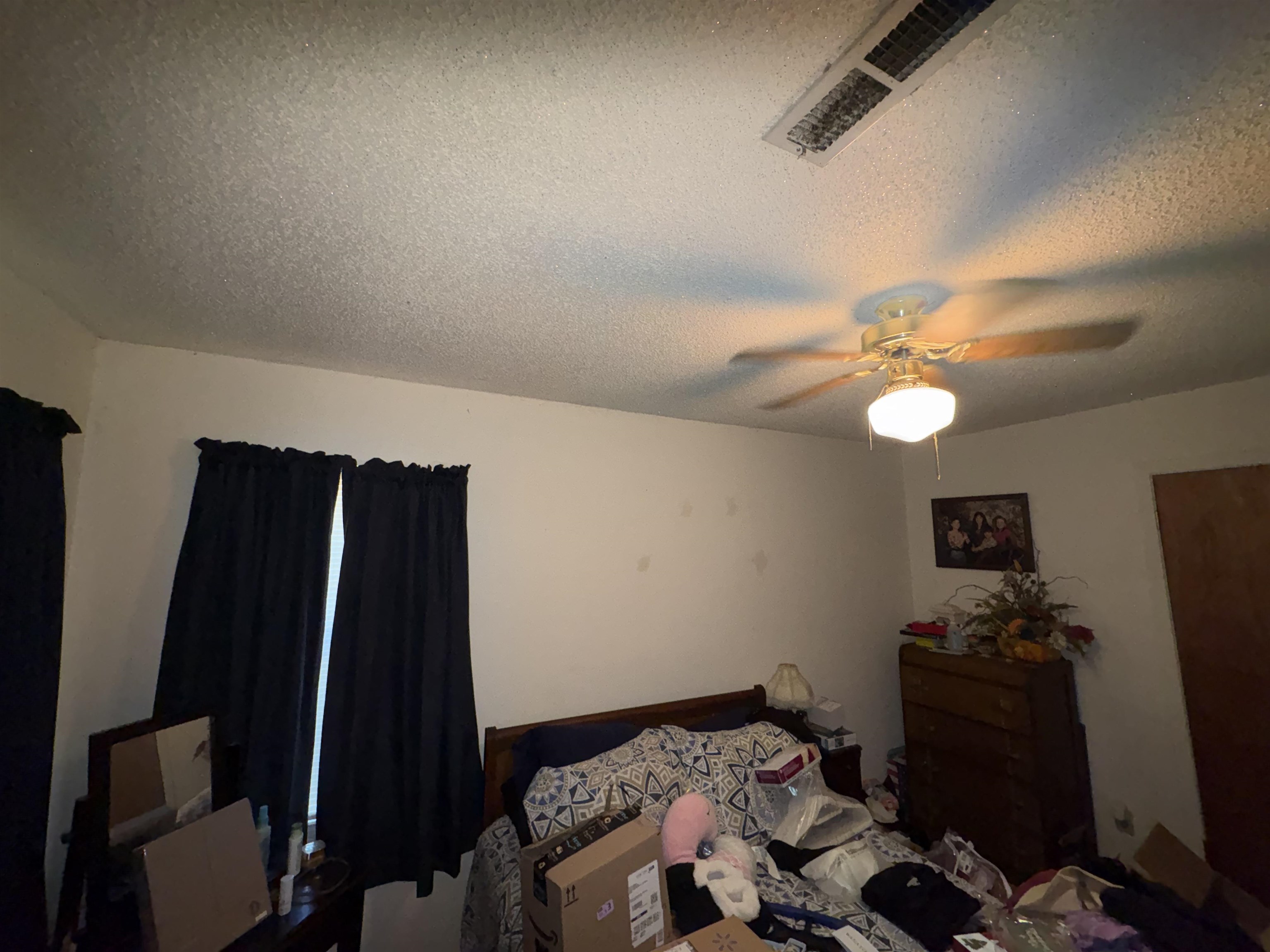 5091 Clinton Road Memphis, TN 38109 - Photo 33 of 34 a bedroom with a bed and a ceiling fan