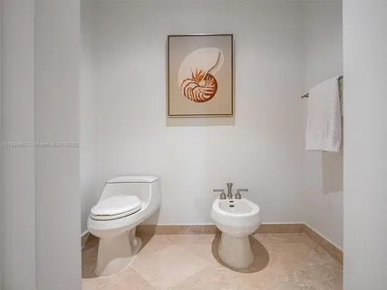 a bathroom with a toilet and a sink