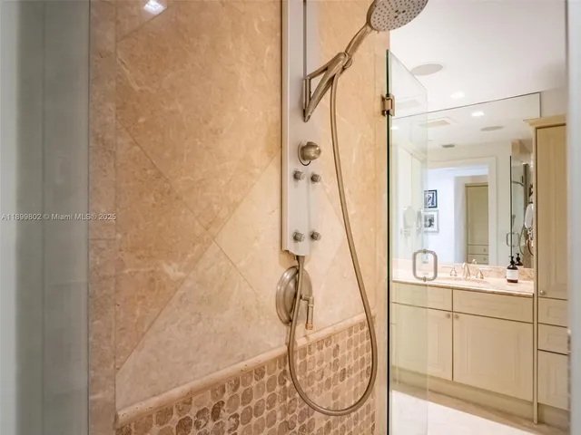 a bathroom with a sink and mirror
