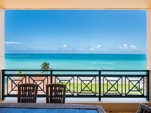 a view of swimming pool from a balcony