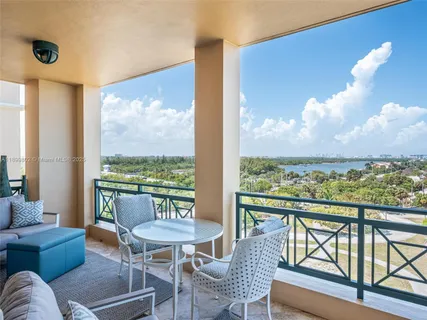 a balcony with furniture and outdoor view