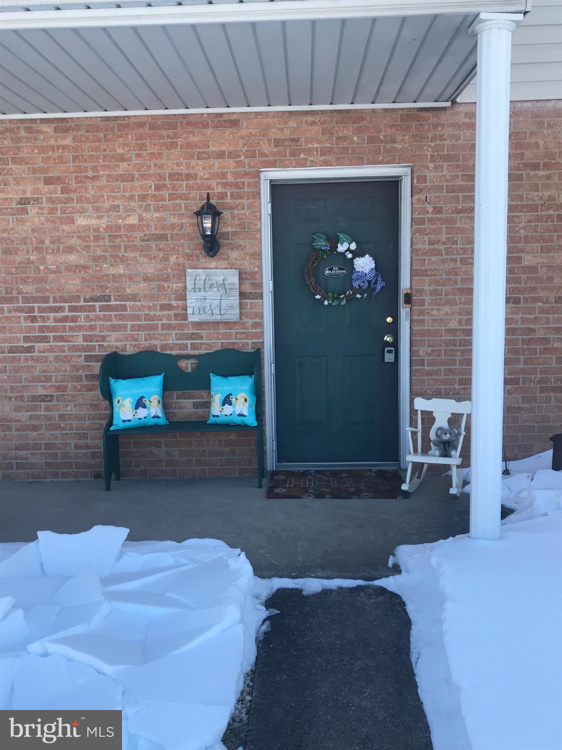 22 Covington Drive Manchester, PA 17345 - Photo 2 of 3 Charming winter entryway with festive decor.