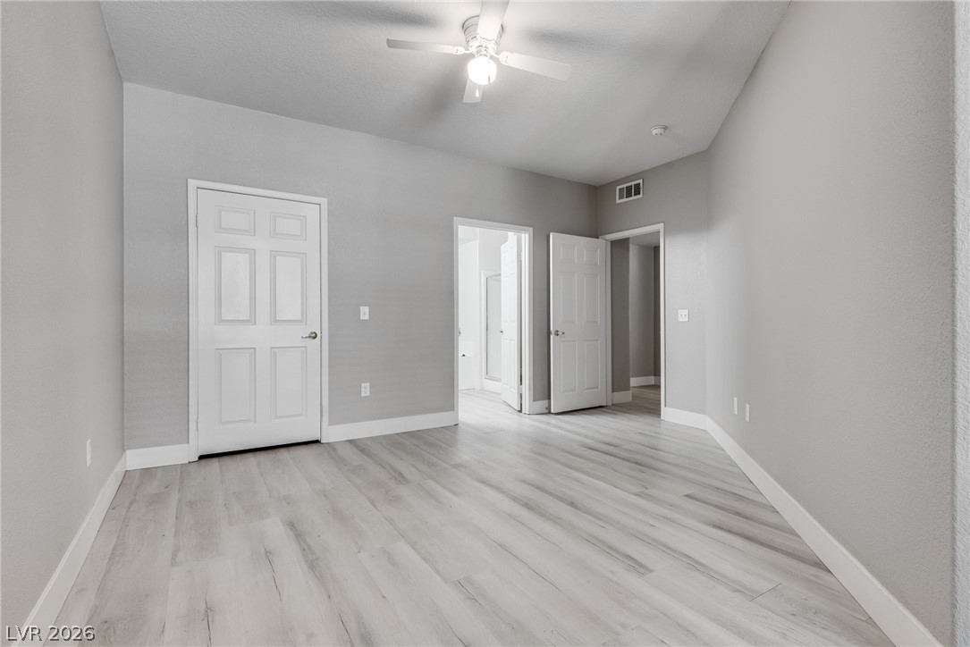 10550 West Alexander Road, Unit 1139 Las Vegas, NV 89129 - Photo 22 of 27 Luminous flooring extends across this spacious room, ready for personalization.