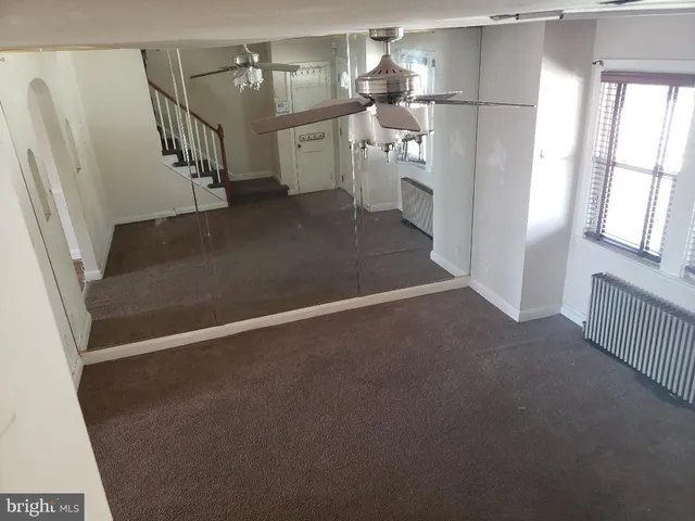 a view of entryway and hall with a window