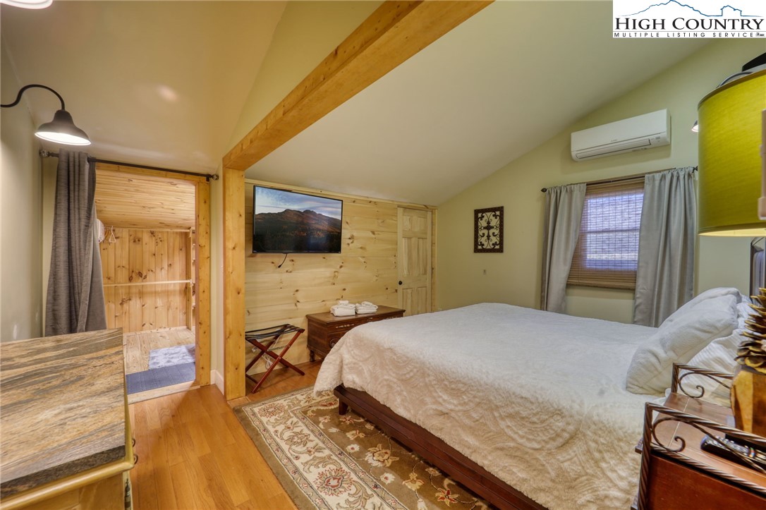 72 Arnett Road Banner Elk, NC 28604 - Photo 23 of 38 a bedroom with a bed and a flat screen tv