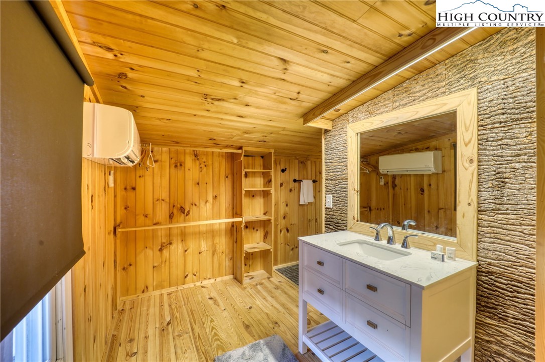 72 Arnett Road Banner Elk, NC 28604 - Photo 26 of 38 a bathroom with a double vanity sink mirror and shower