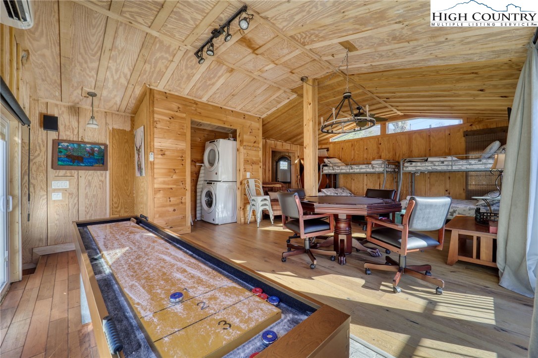 72 Arnett Road Banner Elk, NC 28604 - Photo 29 of 38 a living room with lots of furniture and gym equipment