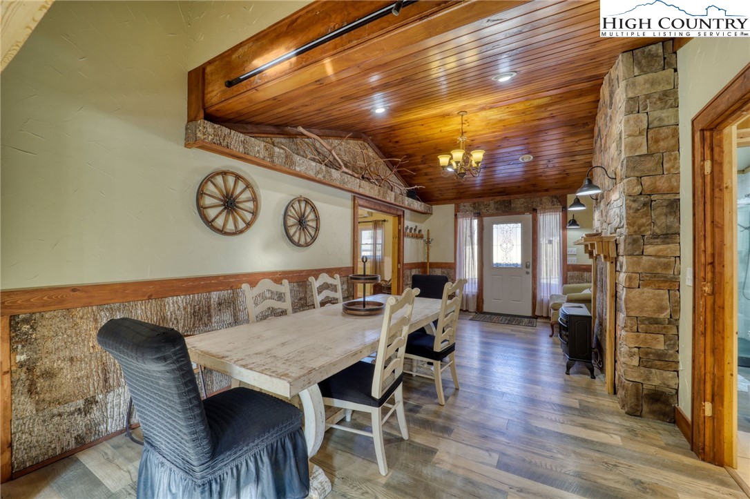 72 Arnett Road Banner Elk, NC 28604 - Photo 3 of 38 a dining room with a wooden table and chairs