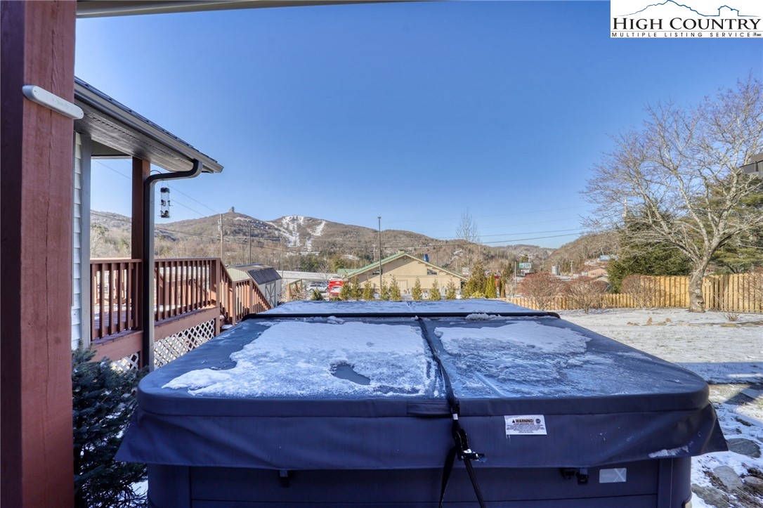 72 Arnett Road Banner Elk, NC 28604 - Photo 33 of 38 a view of a terrace with a table and chairs