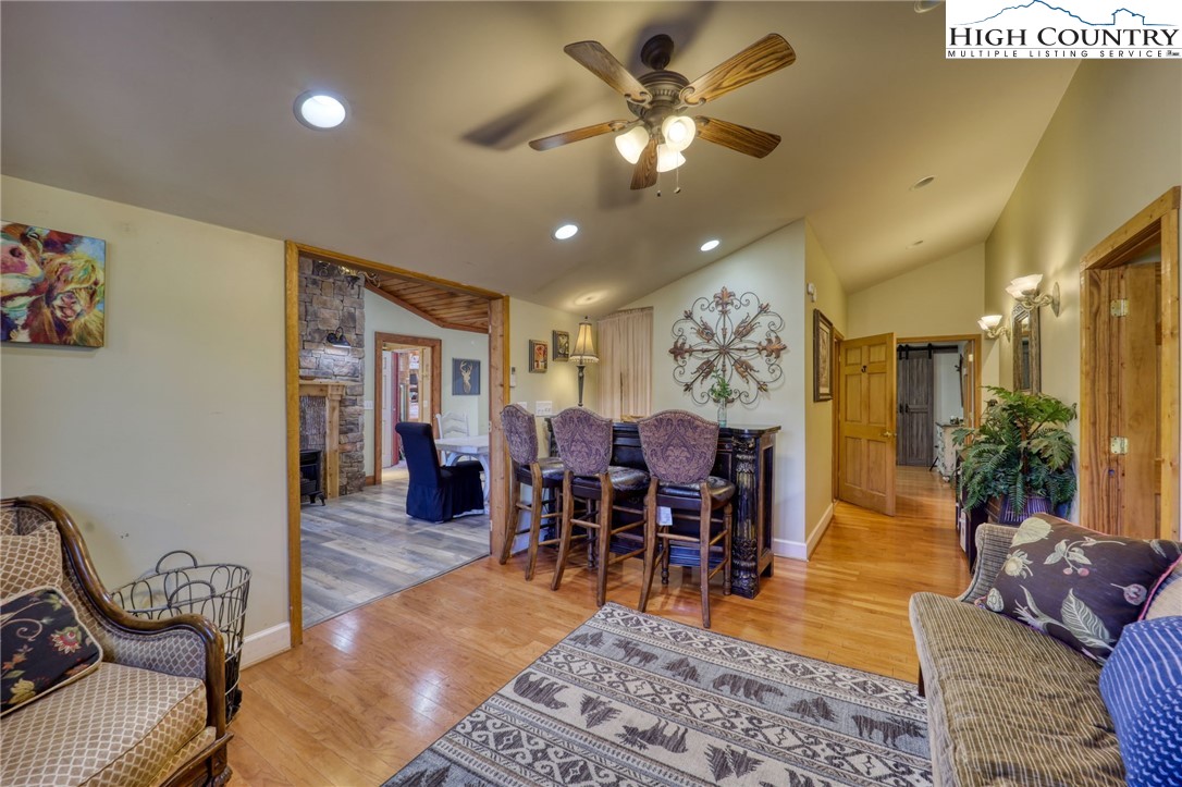 72 Arnett Road Banner Elk, NC 28604 - Photo 6 of 38 a living room with furniture a dining table and a piano