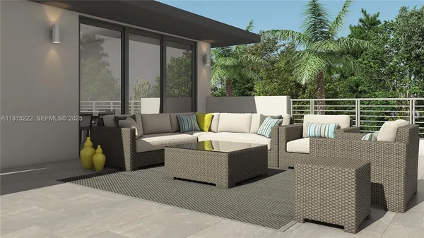 a living room with couches and a potted plant on a table