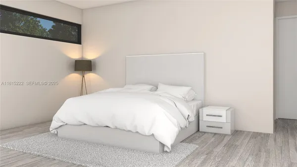 a large white bed in a white room