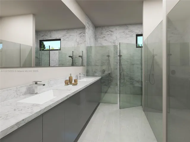 a bathroom with a granite countertop sink a mirror and shower