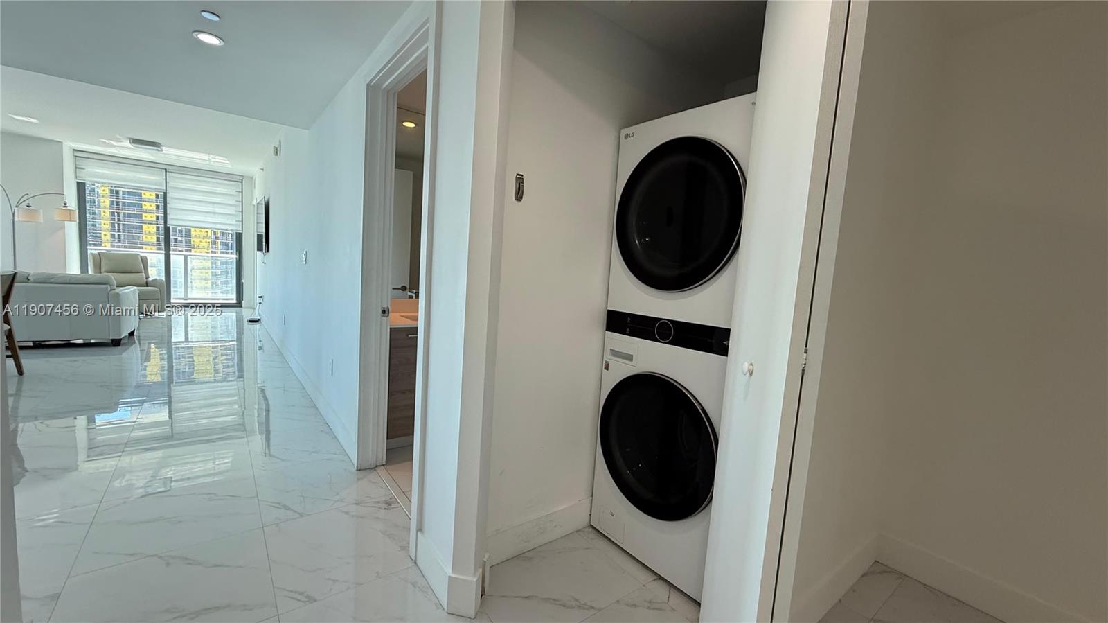 1300 South Miami Avenue, Unit 2005 Miami, FL 33130 - Photo 22 of 46 a view of a hallway with washer and dryer