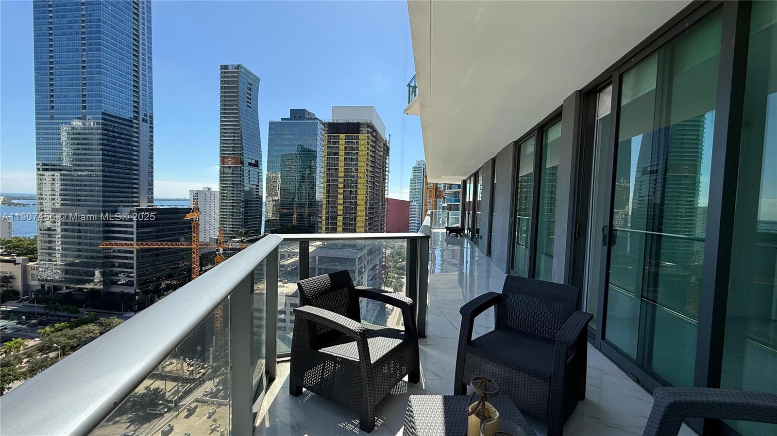 1300 South Miami Avenue, Unit 2005 Miami, FL 33130 - Photo 26 of 46 a balcony with table and chairs