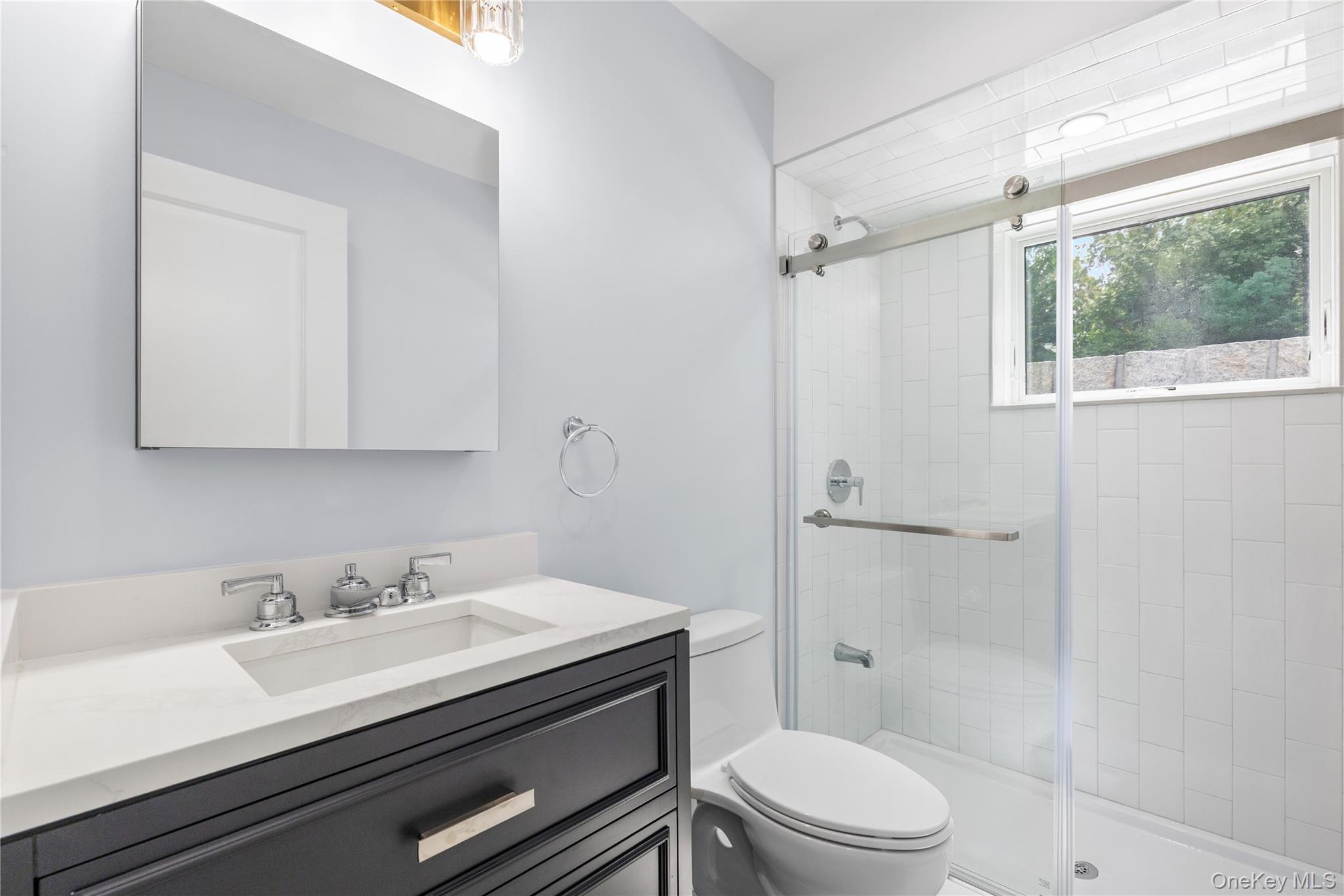 535 2nd Street, Unit DUPLEX R Mamaroneck, NY 10543 - Photo 22 of 32 The Lower Level Bathroom enjoys natural light and stylish fixtures.