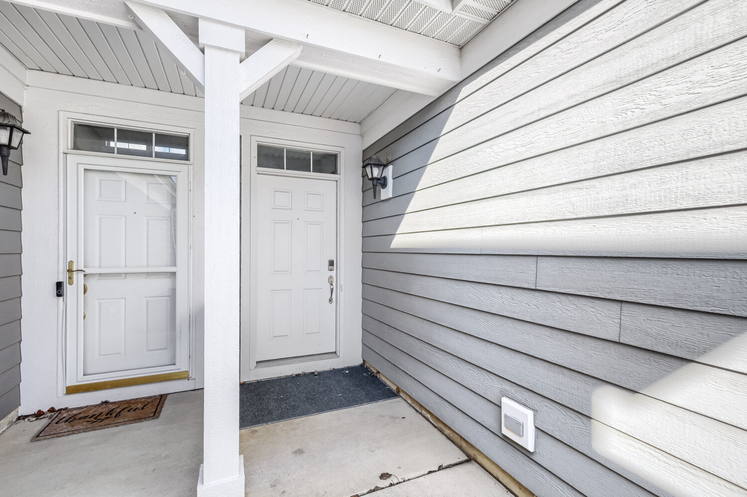 422 Victoria Lane Elgin, IL 60124 - Photo 19 of 22 a view of a house with a door and wooden walls