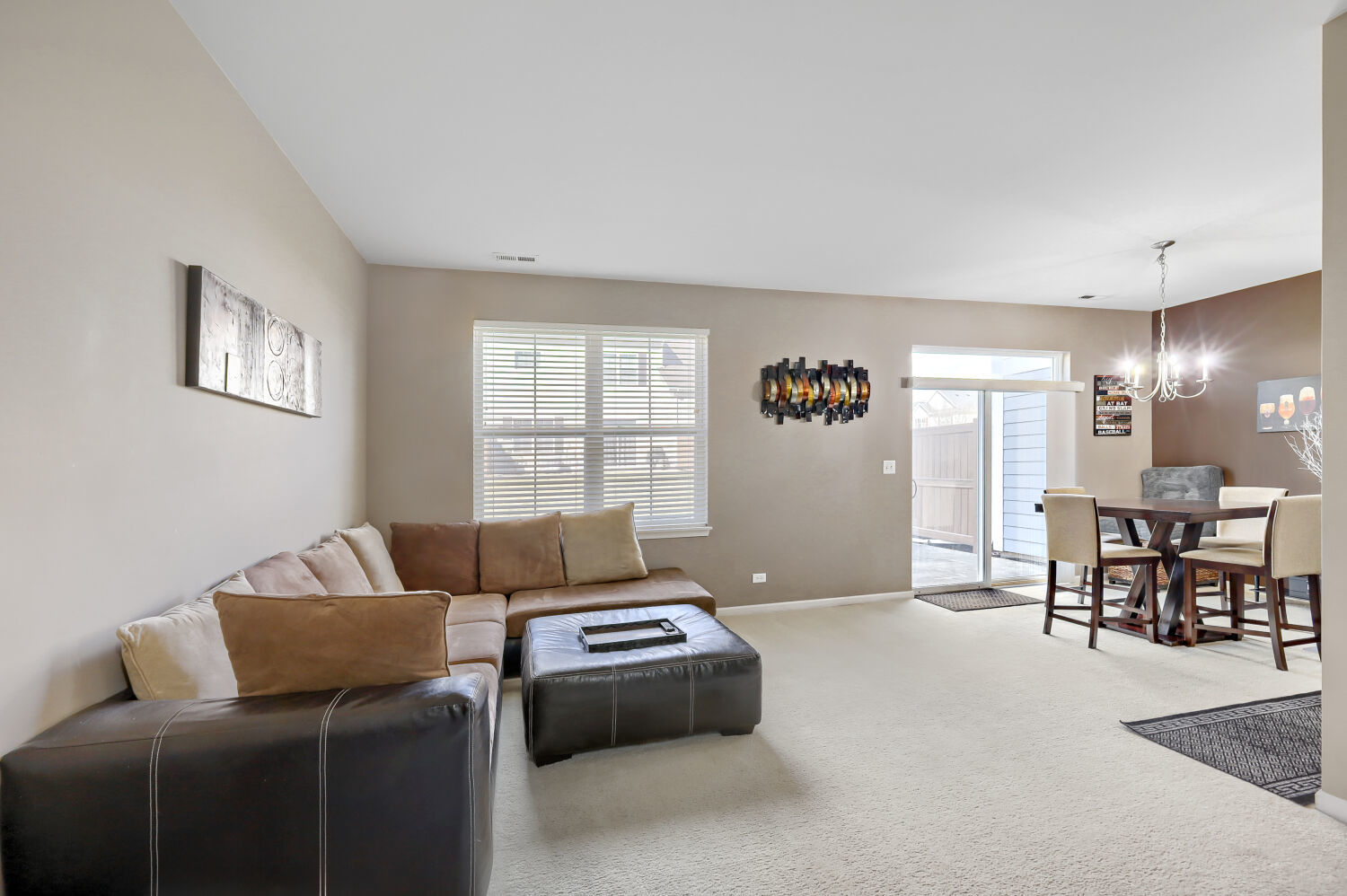 422 Victoria Lane Elgin, IL 60124 - Photo 2 of 22 a living room with furniture and a window