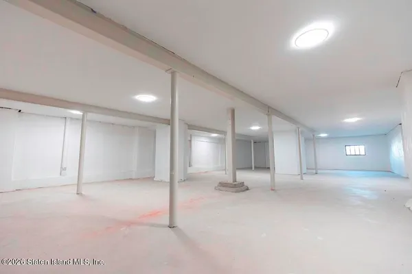 a view of empty room with a fireplace