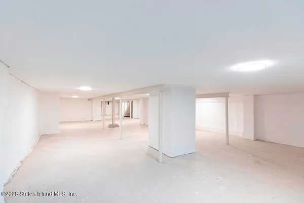 a view of a big room with stainless steel appliances kitchen island