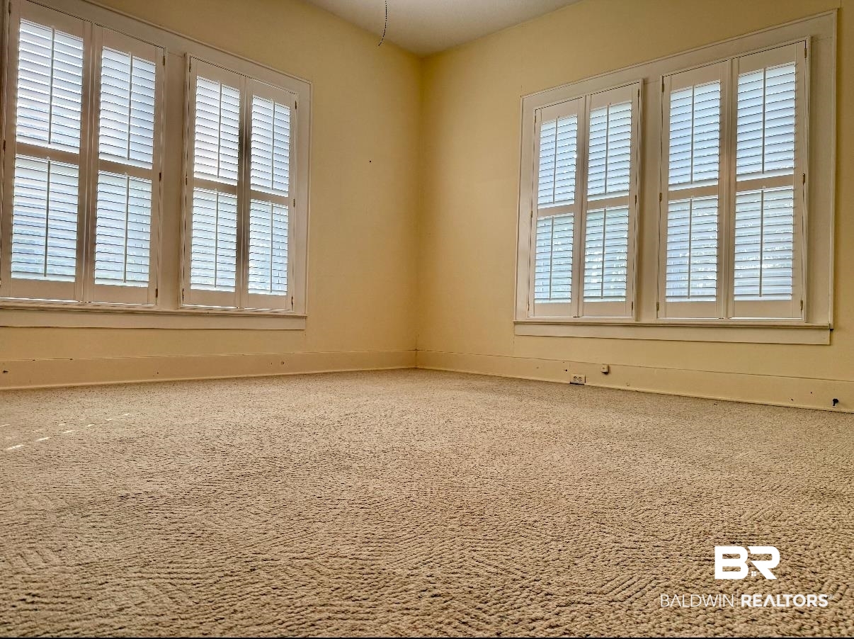 423 Evergreen Avenue Brewton, AL 36426 - Photo 17 of 18 Carpeted spare room featuring healthy amount of natural light