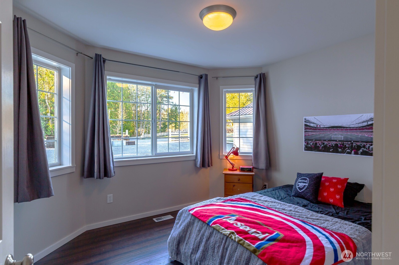 20129 Tveit Road Arlington, WA 98223 - Photo 11 of 31 a bedroom with a bed and a window