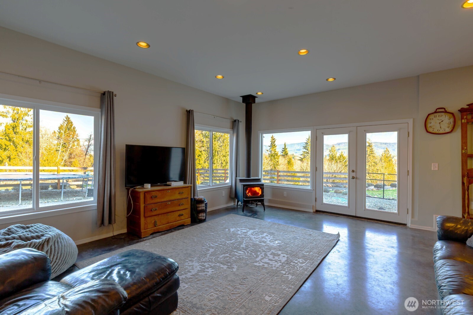 20129 Tveit Road Arlington, WA 98223 - Photo 13 of 31 a living room with furniture and a flat screen tv