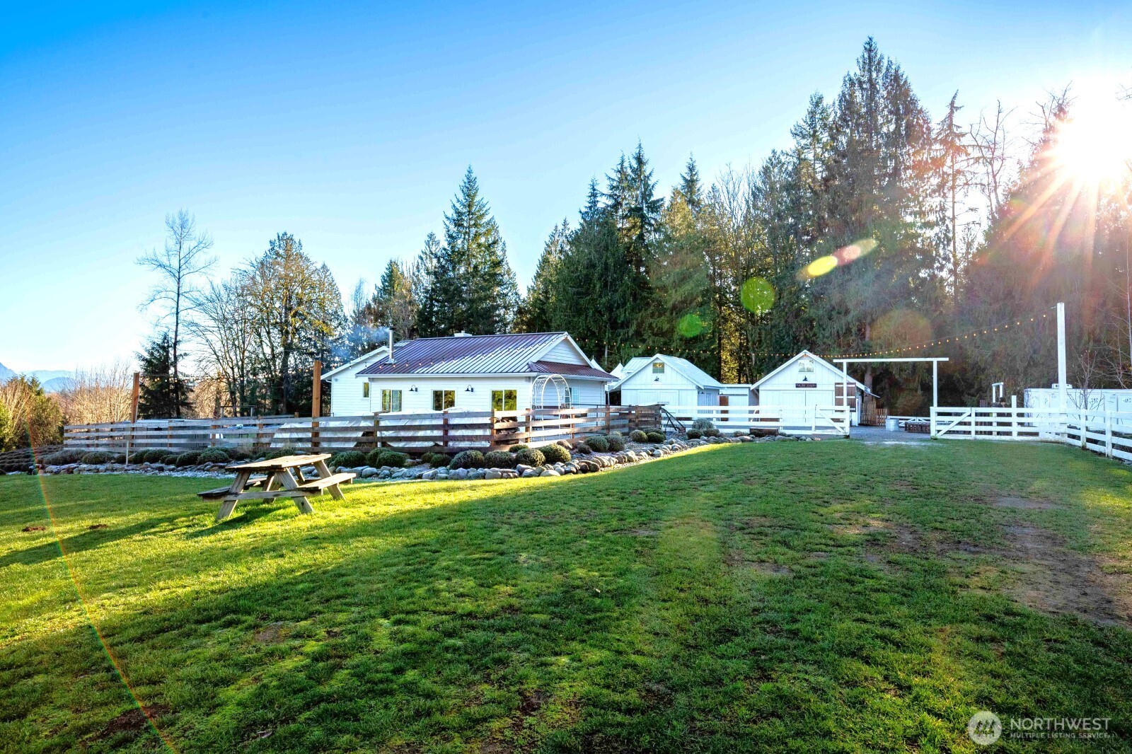 20129 Tveit Road Arlington, WA 98223 - Photo 19 of 31 a view of a house with garden and a yard