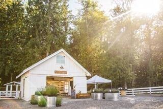 20129 Tveit Road Arlington, WA 98223 - Photo 23 of 31 a view of a white house next to a road and trees