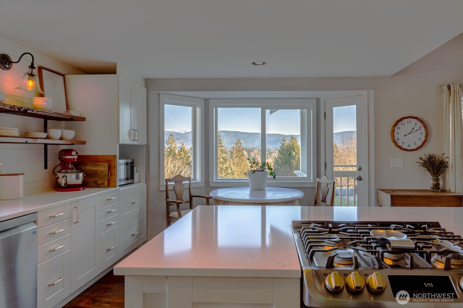 20129 Tveit Road Arlington, WA 98223 - Photo 3 of 31 a kitchen with stainless steel appliances granite countertop a stove and a sink