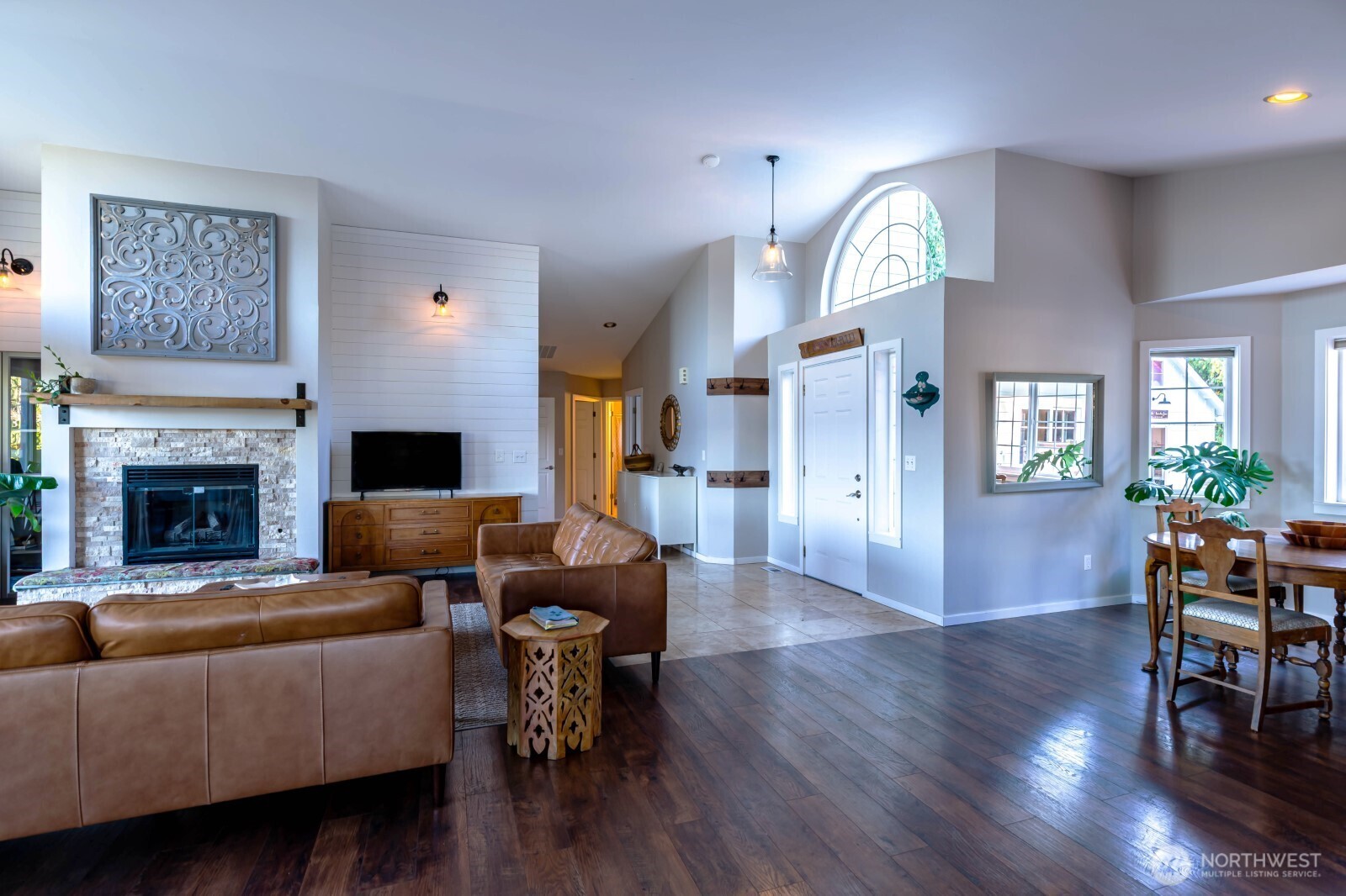 20129 Tveit Road Arlington, WA 98223 - Photo 6 of 31 a living room with furniture fireplace and wooden floor