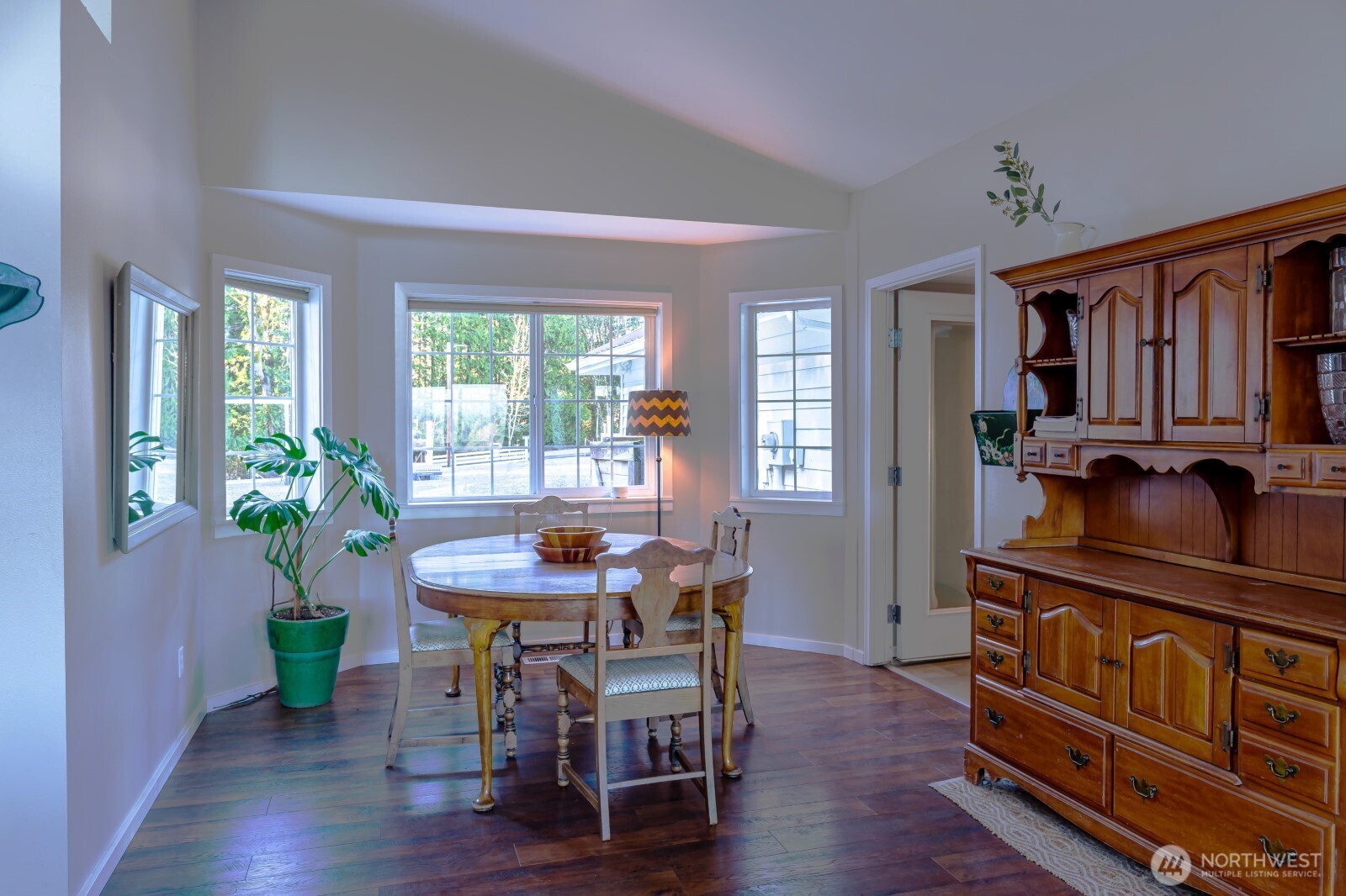 20129 Tveit Road Arlington, WA 98223 - Photo 7 of 31 a view of a dining room with furniture window and wooden floor