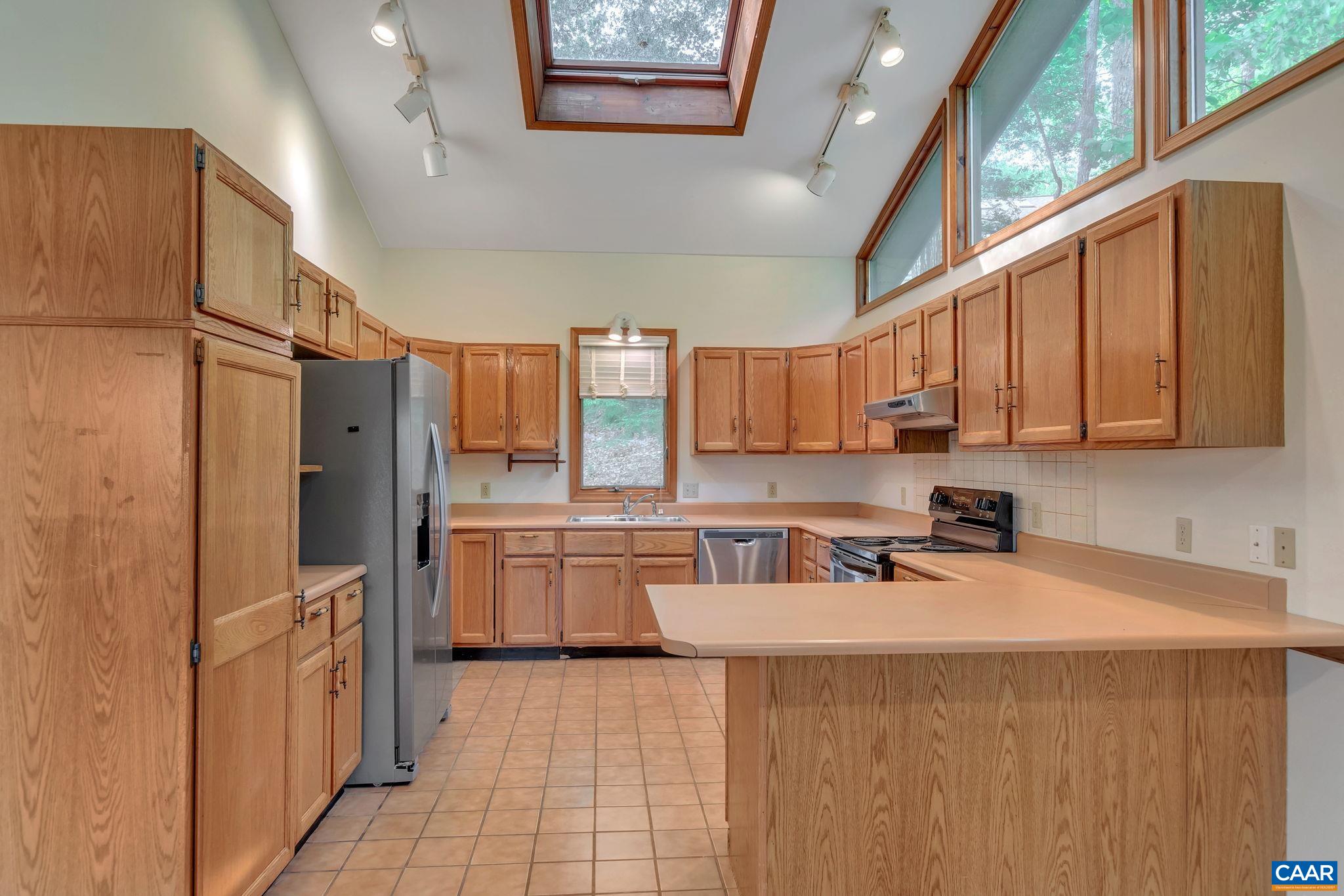 16 Bonita Road Palmyra, VA 22963 - Photo 11 of 39 a kitchen with stainless steel appliances a refrigerator sink and cabinets