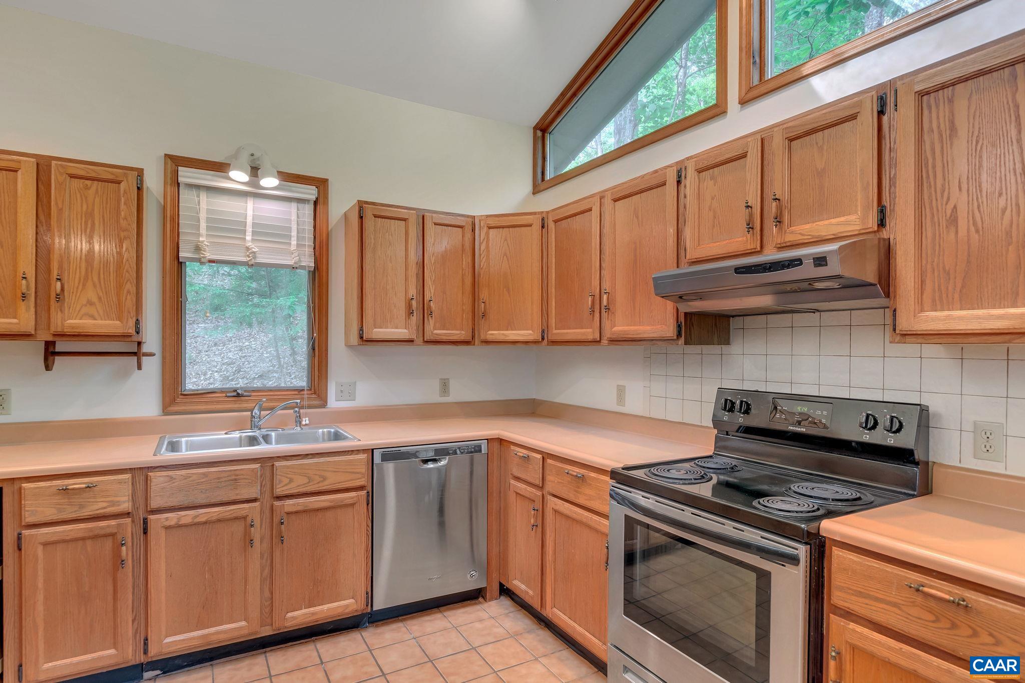 16 Bonita Road Palmyra, VA 22963 - Photo 12 of 39 a kitchen with granite countertop a stove sink and cabinets