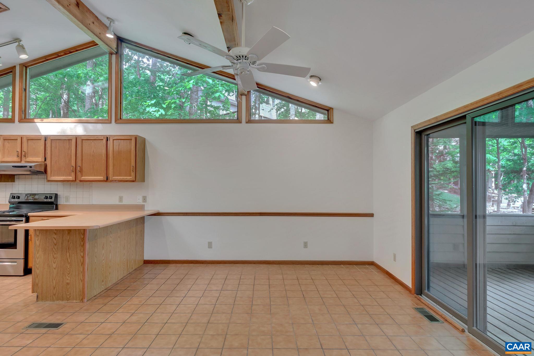 16 Bonita Road Palmyra, VA 22963 - Photo 15 of 39 a view of a kitchen with a sink wooden cabinets and a window