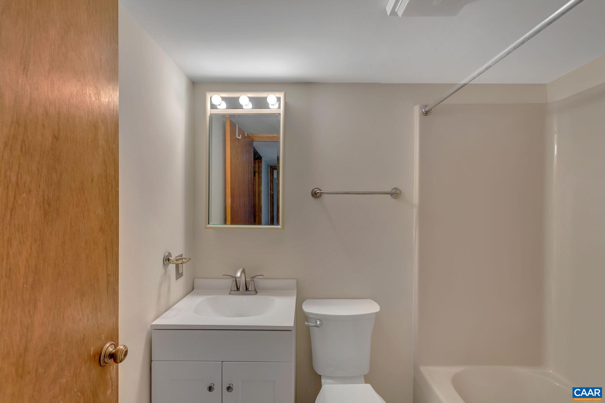 16 Bonita Road Palmyra, VA 22963 - Photo 24 of 39 a bathroom with a toilet sink and mirror