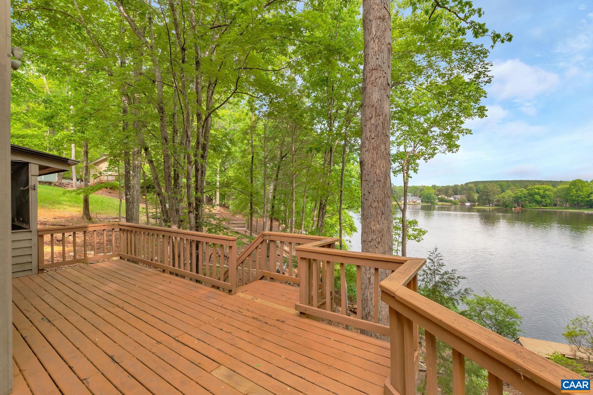 16 Bonita Road Palmyra, VA 22963 - Photo 5 of 39 a view of a wooden deck with a lake