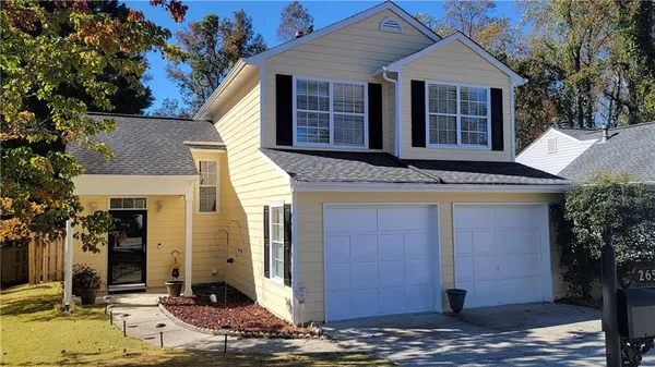 a front view of a house with a yard