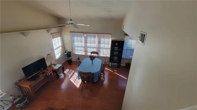 a workspace with furniture hardwood and a window