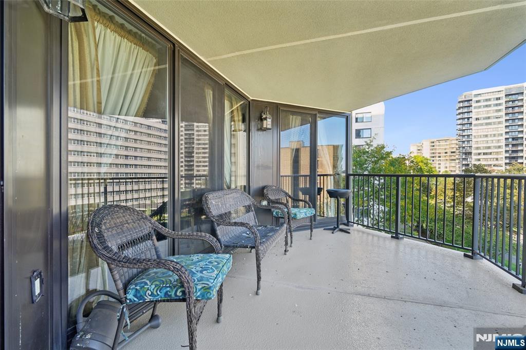 245 Prospect Avenue, Unit 5B Hackensack, NJ 07601 - Photo 23 of 35 a balcony with furniture and a potted plant