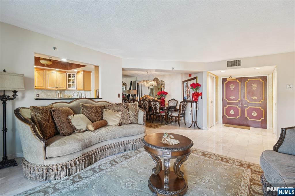 245 Prospect Avenue, Unit 5B Hackensack, NJ 07601 - Photo 3 of 35 a living room with furniture