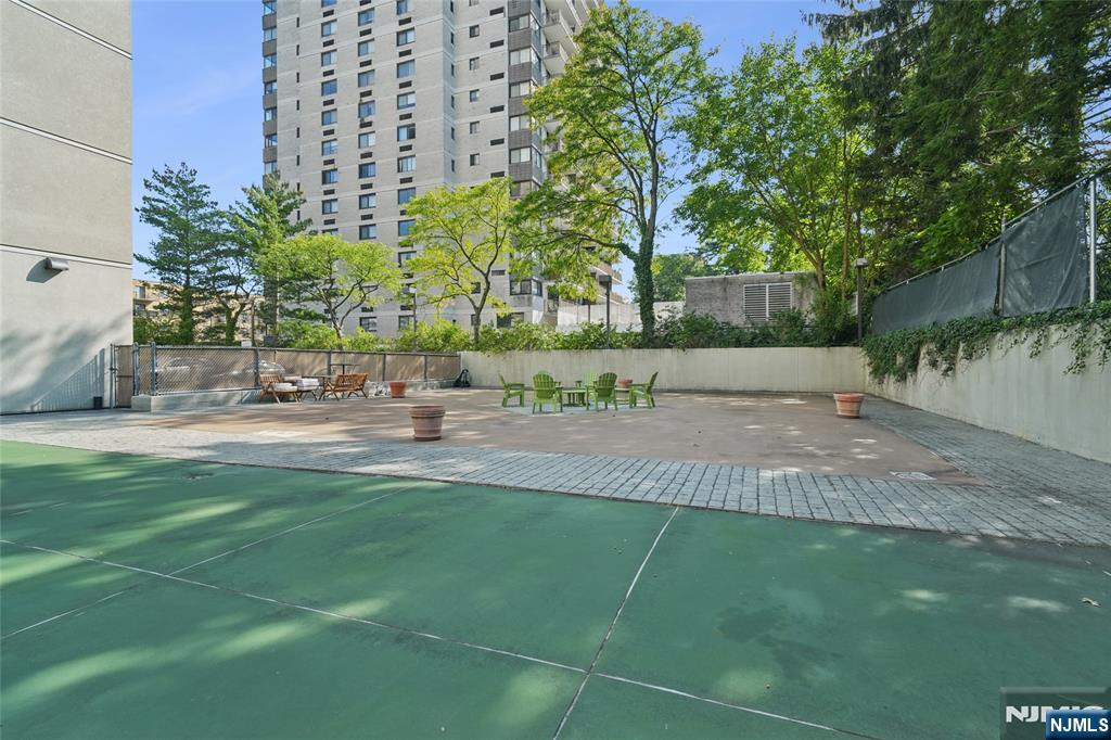 245 Prospect Avenue, Unit 5B Hackensack, NJ 07601 - Photo 32 of 35 a view of a yard with plants and trees