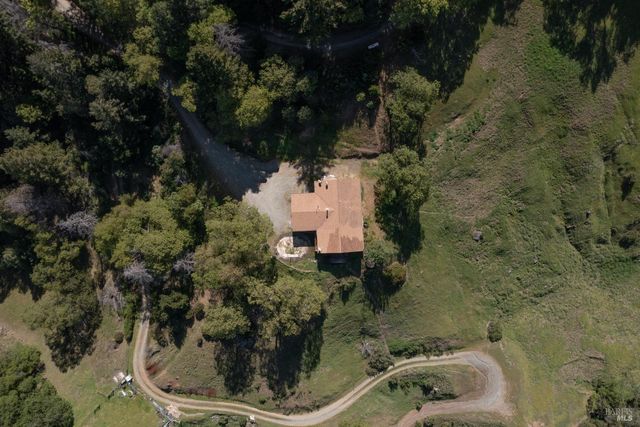 a view of a sink and yard with green space