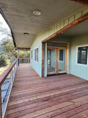 a view of a porch and wooden floor